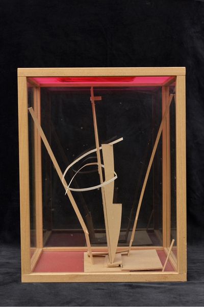 Model in glass case with red base