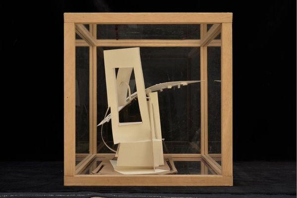 Tall paper and cardboard model in case