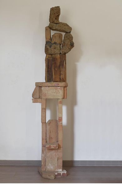 Tufa, wood and brick totem