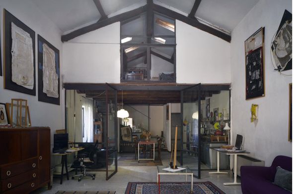 Sutri studio — central atrium with mezzanine