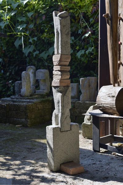 Peperino and brick totem