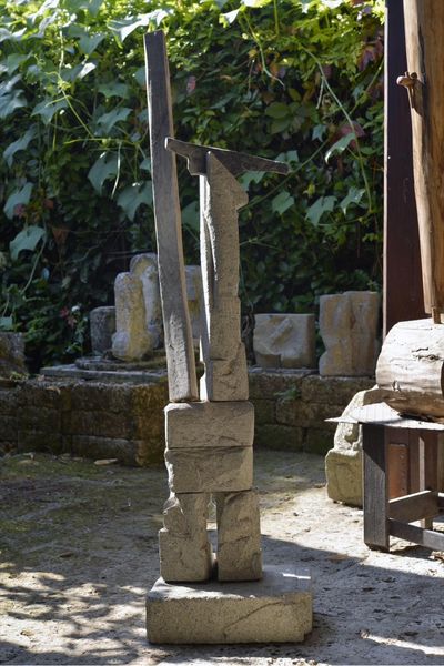 Peperino and wood totem